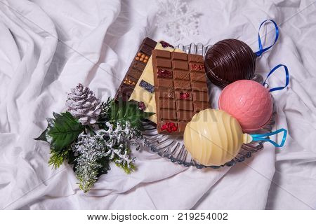 Homemade Chocolate Bar  . Handmade Sweets On White Textile Background.