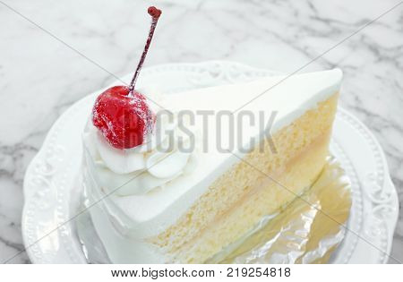 Closeup Milk cake with delicious on white marble table in coffee shop sweet and dessert concept selective focus