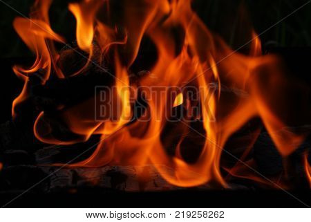 fire on dark background red light orange