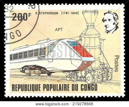 Kiev Ukraine December 22 2017: Stamp printed by Congo Color edition on topic of Railway devoted 200th birthday of George Stephenson shows train of white and red color CIRCA 1982