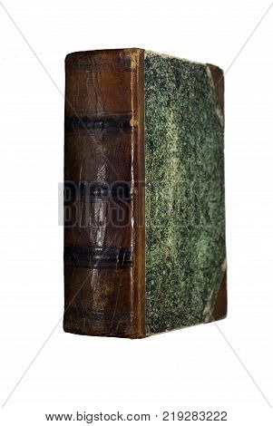 ancient books book with a cracked leather spine and green patterned binding isolated