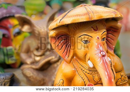 Colorful dolls made of clay Lord Ganesha handicrafts on display during the Handicraft Fair in Kolkata earlier Calcutta West Bengal India. It is the biggest handicrafts fair in Asia.