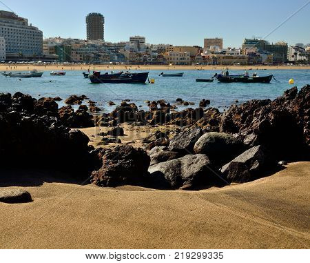 Cove of sand and rocks at low tide, Las Canteras beach, Las Palmas of Gran canaria, Spain
