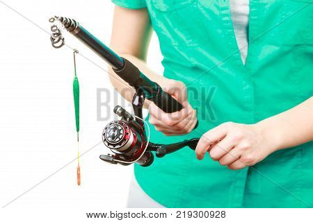 Spinning sport equipment concept. Person holding fishing rod with float and waggler with line.