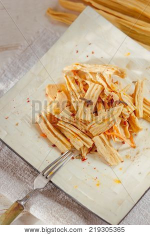 Yuba or fuju salad in a white bamboo plate