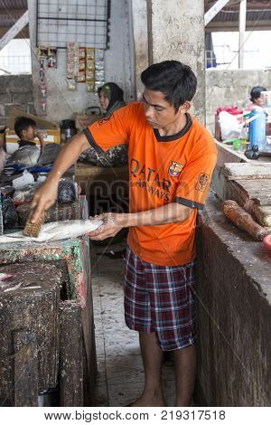Labuanbajo Indonesia - August 17 2015: Photo from traditional exotic tribal market in Indonesia Fish seller Indonesia