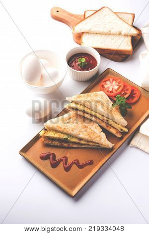 Indian Bread omelette / omlet / omlete sandwich served with tomato ketchup