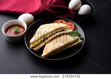 Indian Bread omelette / omlet / omlete sandwich served with tomato ketchup
