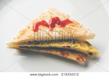 Indian Bread omelette / omlet / omlete sandwich served with tomato ketchup