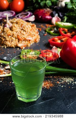tarkhun soda traditional armenian green drink on vegetable background. Nonalcoholic refreshing beverages.