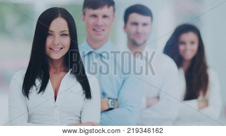 concept of team work.a woman leader of a business team and colle