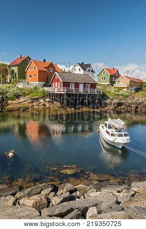 Fishing village Henningsvaer in Lofoten islands, Norway with typical colorful wooden buildings