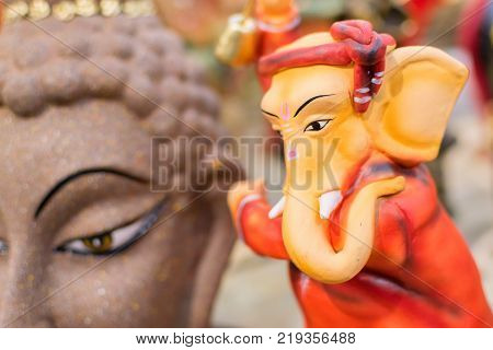 Colorful dolls made of clay Lord Ganesha handicrafts on display during the Handicraft Fair in Kolkata earlier Calcutta West Bengal India. It is the biggest handicrafts fair in Asia.