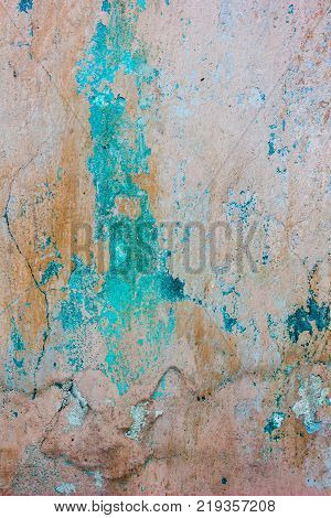 Old weathered concrete wall texture threadbare colored with different colors.