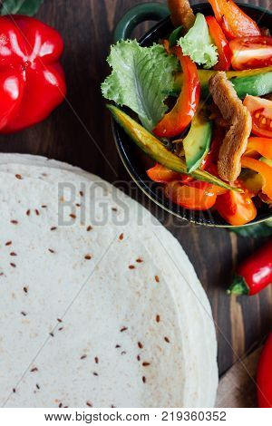 Top view of mexican fachitos and tortilla bread.
