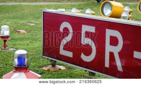 BERLIN, GERMANY - JAN 17th, 2015: sign markings on the tarmac of runway at a commercial airport of Schonefeld SXF.