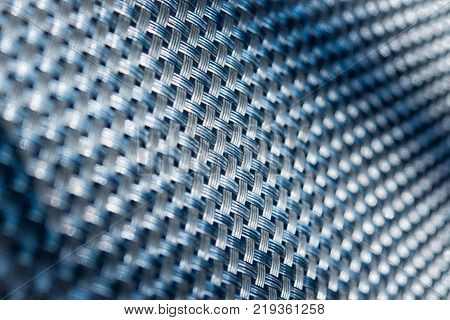 Abstract pattern or background. Blue diagonal grid closeup.