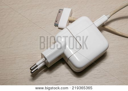 A mobile phone charger on the table.