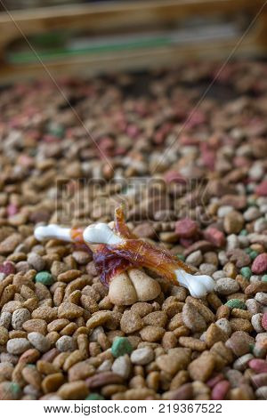 Calcium bones for dog feeding on hip of dry pet food