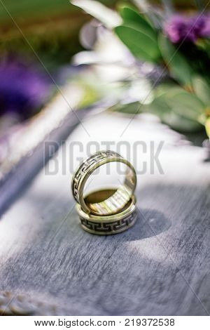 The wedding rings with flowers, marriage concept.
