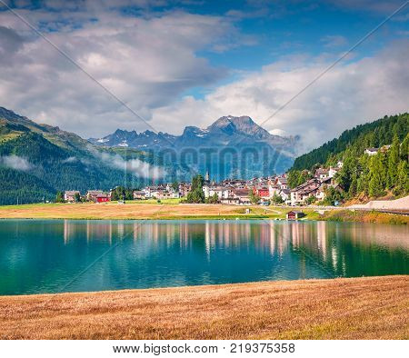 Sunny summer landscape of Silvaplana lake. Splendid morning view of Segl village Maloja pass Upper Engadine in the Swiss canton of the Grisons Switzerland Europe. Artistic style post processed photo.