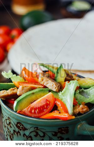 Vegetarian variant of mexican fachitos on wooden board.