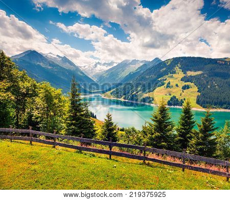 Colorful summer morning on the Speicher Durlassboden lake. View of Richterspitze mountain range in the Austrian Alps Schwaz district in the Tyrol state Austria Europe. Artistic style post processed photo.