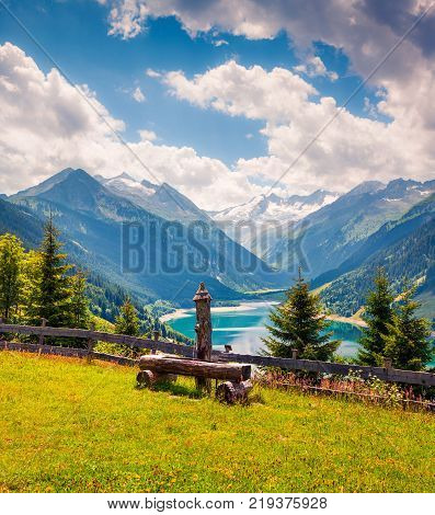 Colorful summer morning on the Speicher Durlassboden lake. View of Richterspitze mountain range in the Austrian Alps Schwaz district in the Tyrol state Austria Europe. Artistic style post processed photo.