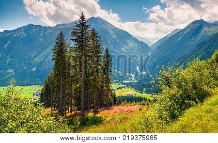 Sunny morning view from Gerlos pass of Acshelkopf mountain range Krimml waterfall and Salzachtal willage in the Austrian Alps Zell am See district state of Salzburg in Austria Europe. Artistic style post processed photo.