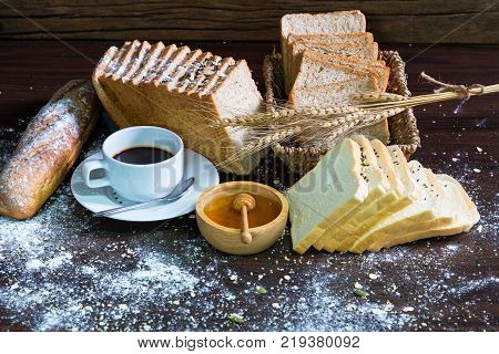 Fresh Tasty Bread With Coffee,sesame, Cereal And Honey Bee On The Table.