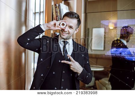 young cheerful groom. fooling around at the wedding. festive mood of a man