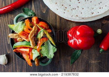 Vegetarian variant of mexican fachitos on wooden board.