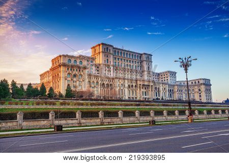 Most famous and larger building in Europe, the Parliament house of Government illuminated by sunset light in Bucharest capital, Romania