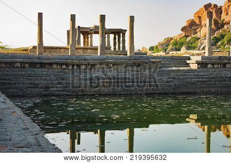 Pushkarani is a sacred lake on the way to the Vitthala temple in Hampi, Karnataka, India. The pond served to the ritual and functional aspects of the temple and life surrounding it.