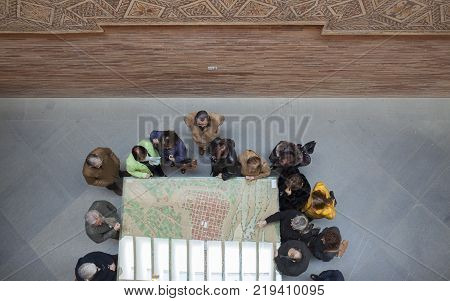 Merida Spain - December 20th 2017: Visitors observing a model of ancient Roman City of Emerita Augusta at National Roman Art Museum Spain
