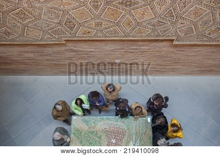 Merida Spain - December 20th 2017: Visitors observing a model of ancient Roman City of Emerita Augusta at National Roman Art Museum Spain