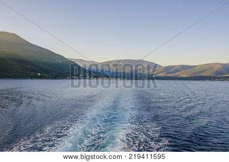 Sailing through the Ionian Sea between the ports of Sami Kefalonia and Pisaetos Ithaka in the background the mountains of the island of Kefalonia