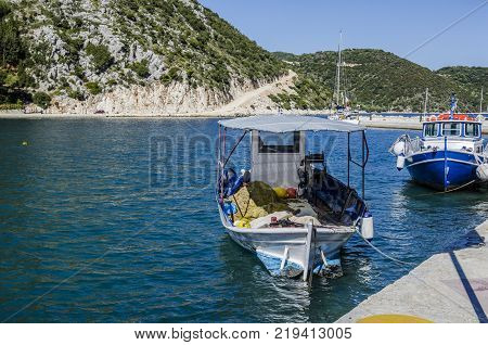 close-up of fishing boat in the harbor of frikes and in the background the mountains surrounding the bay on the island of ithaka greece