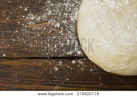 dough with close-up. man is preparing bread dough