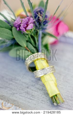 The wedding rings with flowers, marriage concept.
