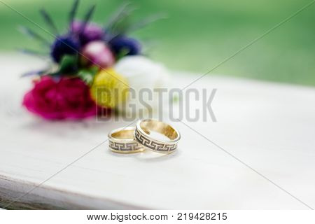 The wedding rings with flowers, marriage concept.