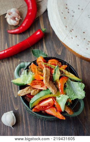 Vegetarian variant of mexican fachitos on wooden board.