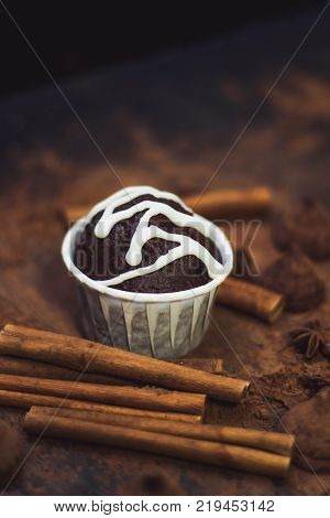 homemade spicy chocolate cupcake sweets and spices mess on the table