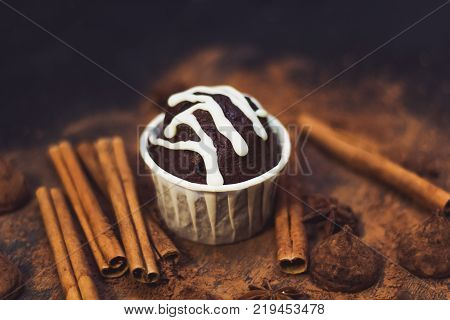 homemade spicy chocolate cupcake sweets and spices mess on the table