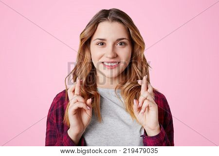 Headshot Of Unhappy Sorrorful Female Curves Lips, Looks Desperately At Camera, Being Upset To Hear B