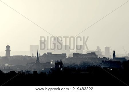 Gotham Retro Photo Filter - London Cityscape at Sunrise with early morning mist from Hampstead Heath looking towards Canary Wharf, England, UK.