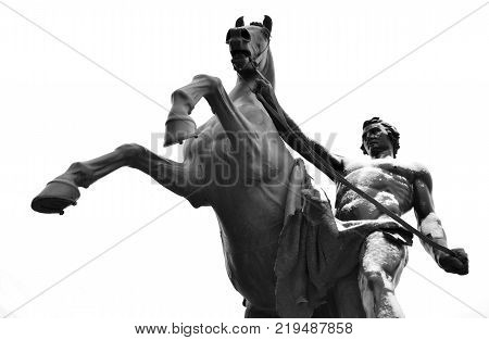 Statue of the conquest of a horse on the Anichkov Bridge in St.Petersburg Russia. Black and white.