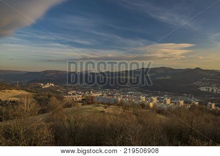 View for Dobetice village and part of town Usti nad Labem in winter sunny day