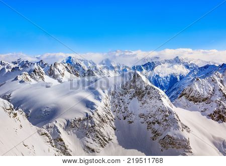 The Alps view from the top of Mt. Titlis in Switzerland in winter. The Titlis is a mountain located on the border between the Swiss cantons of Obwalden and Bern.