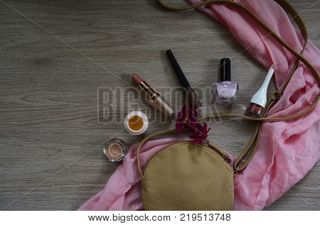 women's cosmetic bag and lipstick, shadows, cream and varnish